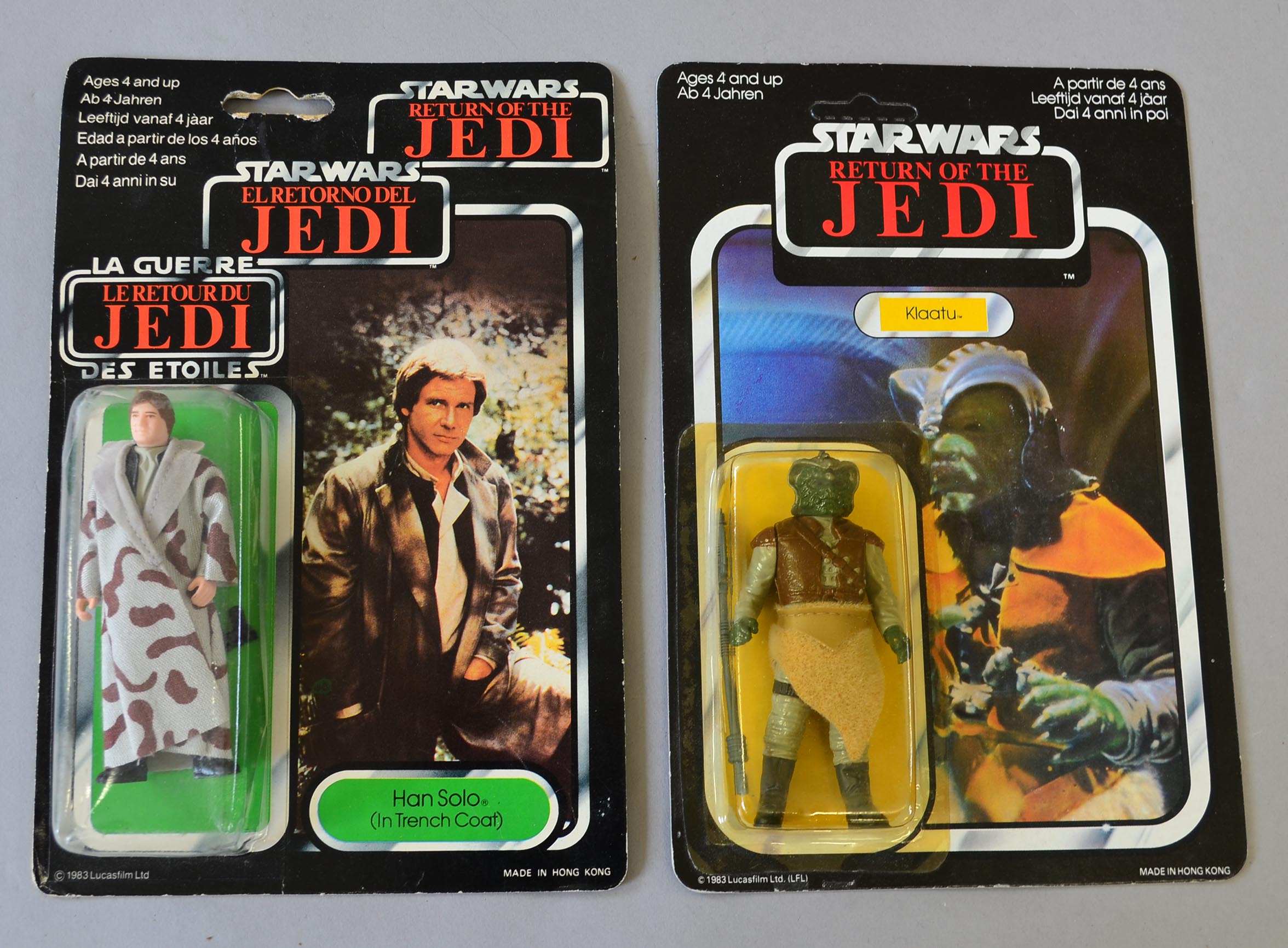 Two Palitoy Star Wars action figures: Han Solo in Trench Coat, sealed on G 79 back ROTJ tri-logo