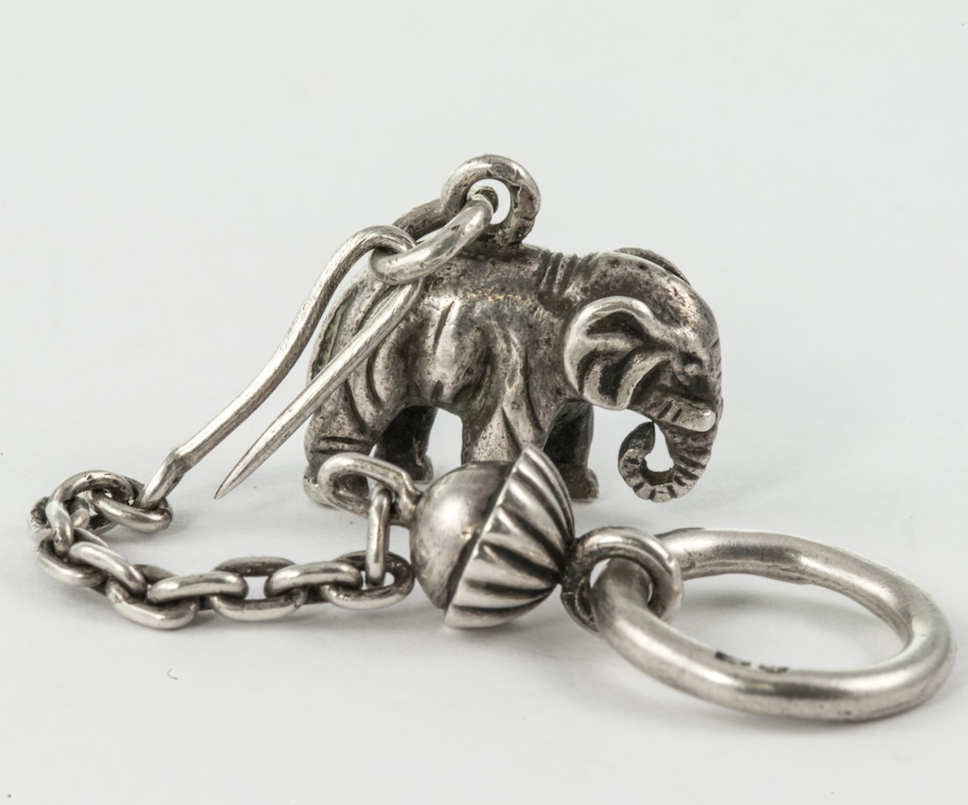 FABERGE CHAIN SUSPENDING RUSSIAN ELEPHANT ? realistically modelled in silver as an elephant in