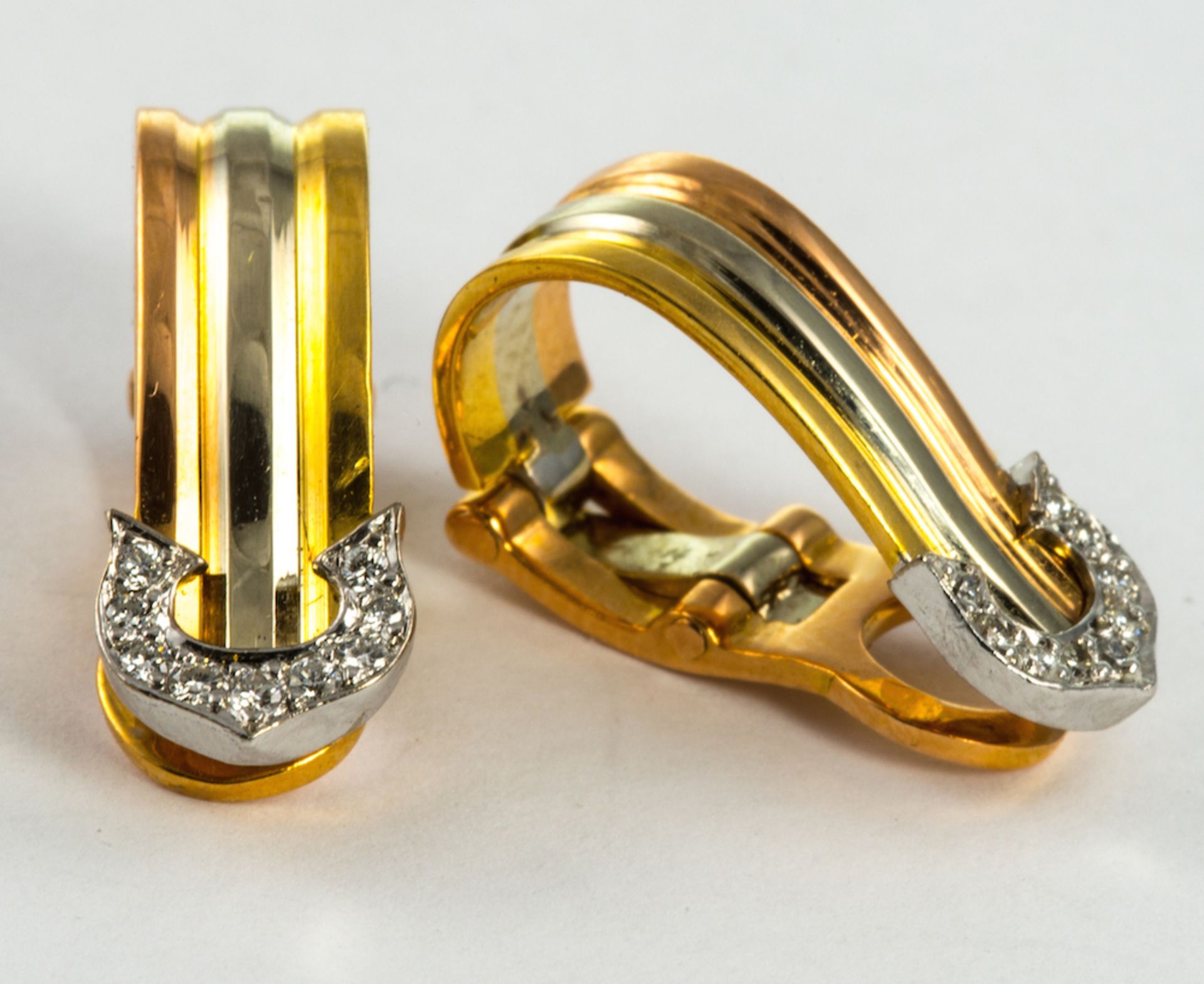 CARTIER ? three colour ?Trinity? stylized hoops, set with circular-cut diamond accents, French