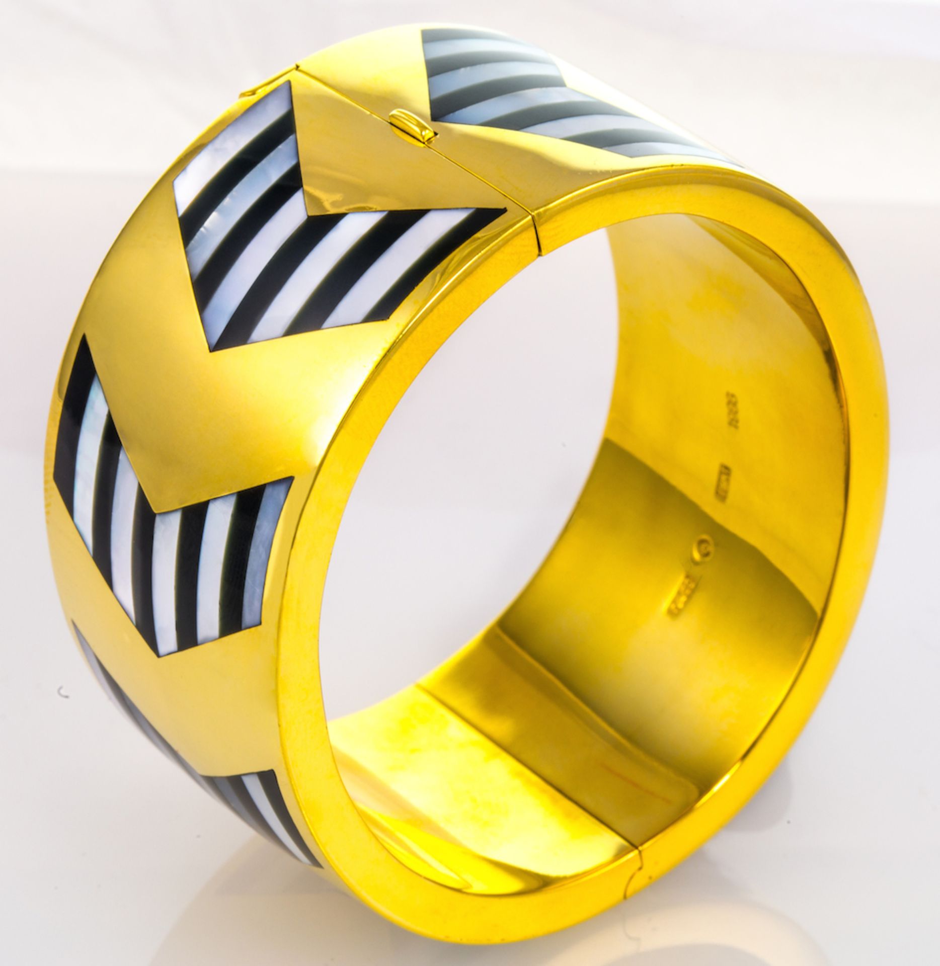 TIFFANY & CO ? of wide hinged design, with chevron design mother-of-pearl and onyx striped repeated