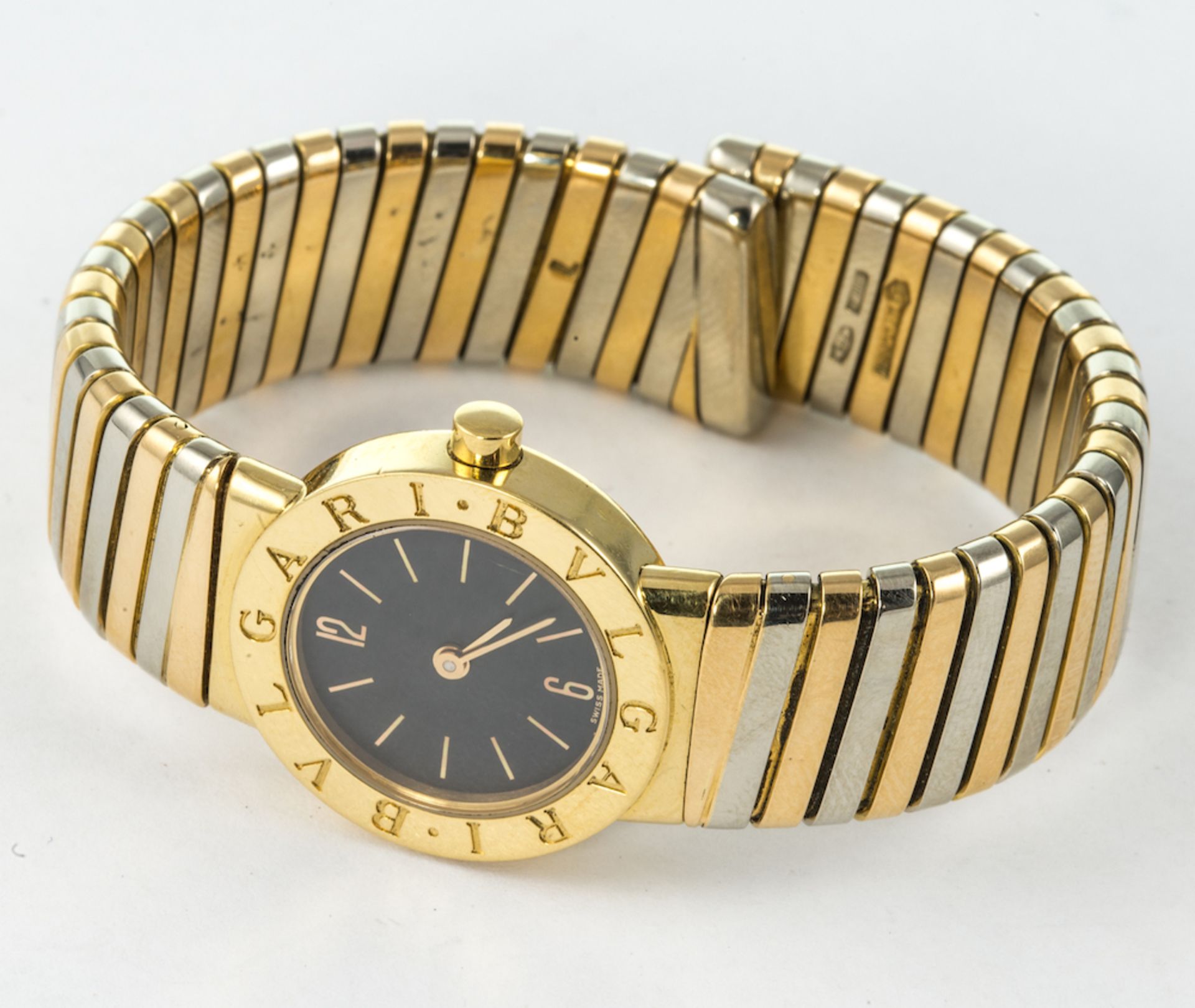 BVLGARI  - ladies 18ct wristwatch from the Tubogas collection, a black dial with gold coloured