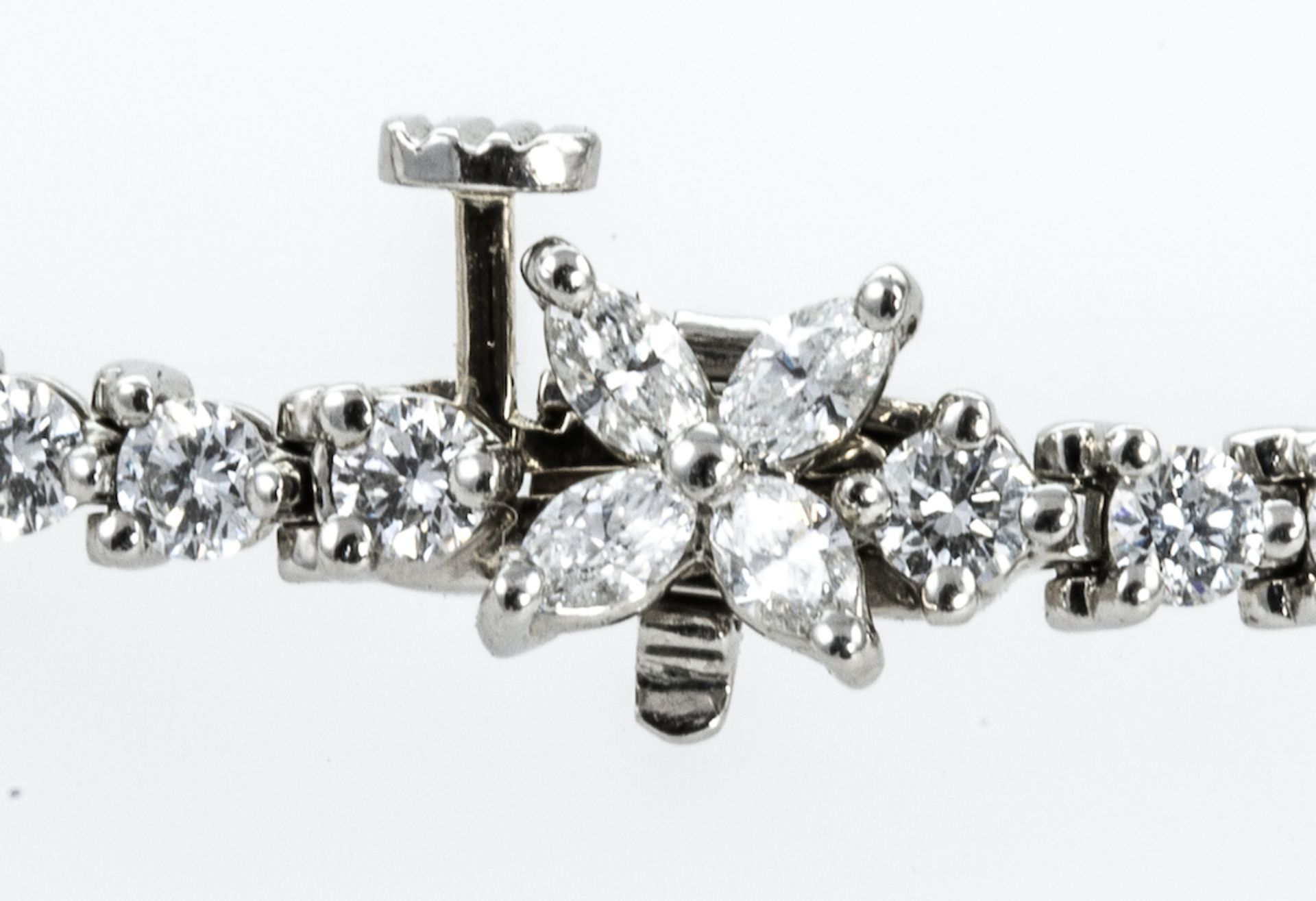 TIFFANY AND CO - a platinum Victoria diamond bracelet, designed as a series of brilliant cut