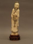 Ivory Figure of a Man with a Basket -.Early 20th century China, carved ivory, approx 29.5cm with a