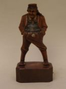 Carved Wooden figure of a Farmer - painted in color, on a polygonal base, southern Germany around