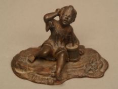 ''Boy with a Drum'' - 19th century, cast iron, rust stains, ca.8x12x7cm.    Starting price: 20