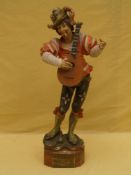 Wooden figure of a lute player - 20th century,painted, signs of age, restored, H. c.92cm.