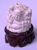Lucky God Budai - Ivory carving, China, 20th century, surrounded by children with peach fruits and