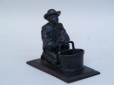 Miner figure kneeling with coal bucket - Berliner Eisen/Berlin Iron, mid 19th century, a black