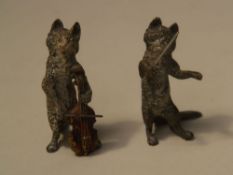 2 Vienna Bronzes - Cat with baton & Cat with violin bass, painted, H.c.6,5cm    Starting price: 170
