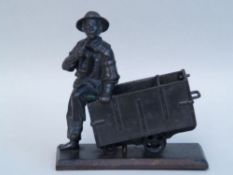 Miner figure with pipe, sitting on a tilted wagon - Berliner Eisen/Berlin Iron, mid 19th century,