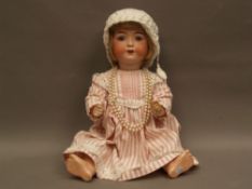 Porcelain head doll - Heubach Köppelsdorf 320-5, standing baby, sleep eyes, two teeth, real hair