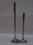 Two candlesticks 20th century. - Bronze / metal, signed, approx 46/67cm H.    Starting price: