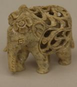 Soapstone Elephant Figurine - India, openwork soapstone carving, with baby elephant in the pierced