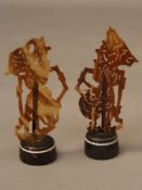 Pair of Wayang Kulit Shadow Puppets - Indonesia, tortoiseshell filigree carved, each on a painted