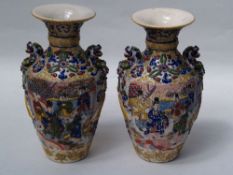 Pair of Vases - 20th century Japan, colorful decor in Satsuma style, use, small glaze damages, H.c.