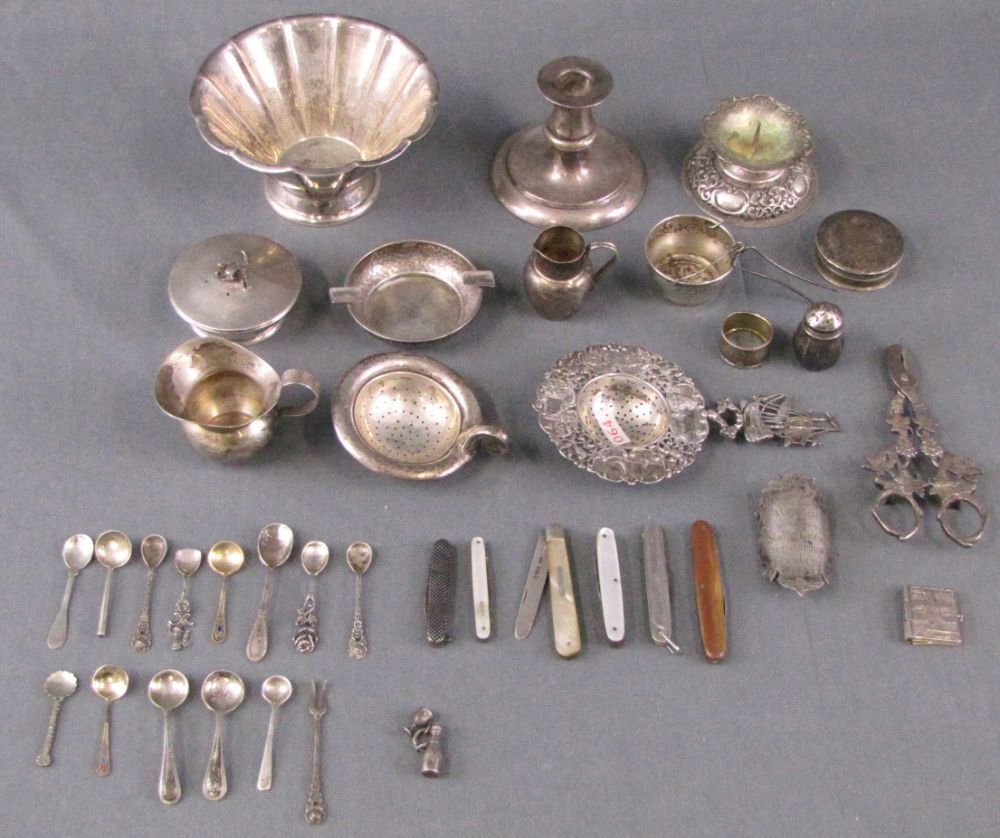 Convolute silver. Also candlesticks, tea strainers, and spoons.  890 grams gross. Alloys not been