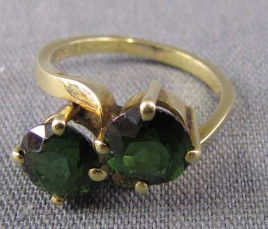 Ring, probably with two tourmalines. 585 yellow gold. 4.8 grams gross.  Inner diameter 1.6 cm.