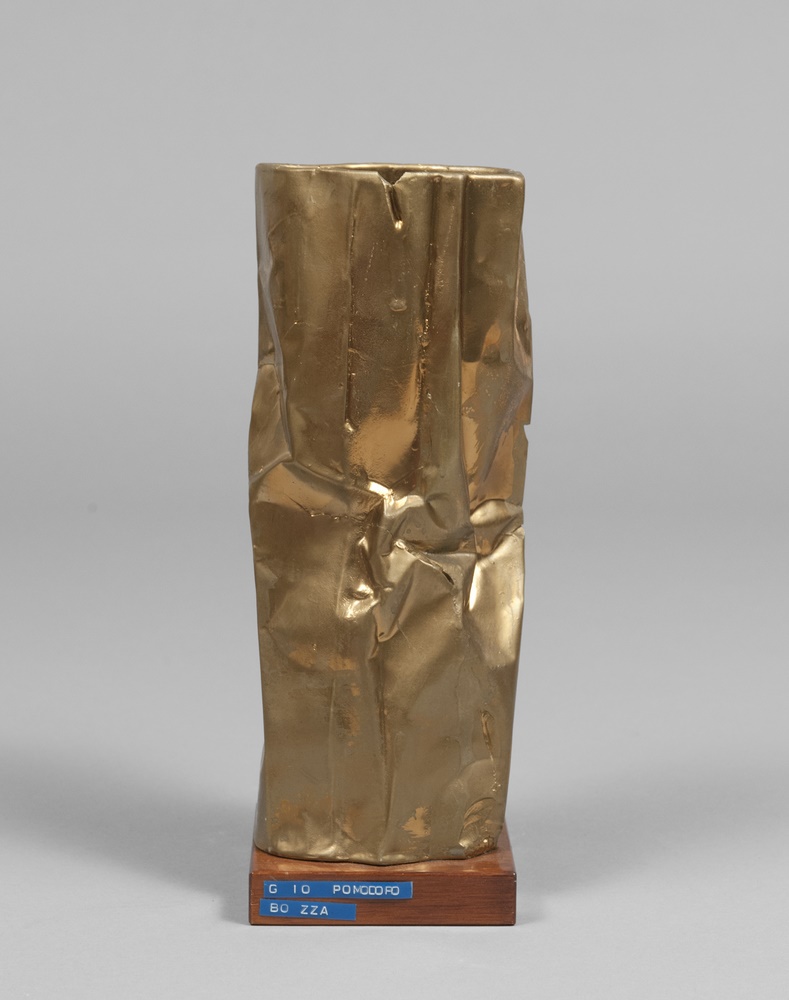 ITALIAN SCULPTOR, 20TH CENTURY  Vase foil shape Sculpture in gilded ceramic, cm. 26 x 11 x 11  Wood