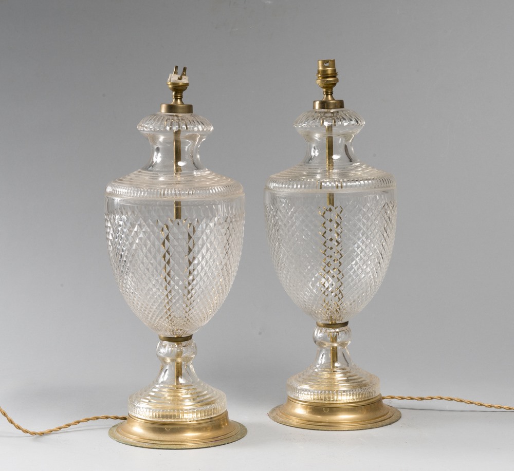 A PAIR OF CUT GLASS LAMPS, 70S baluster body with a diamond tip and brass  disc base.  Measurements