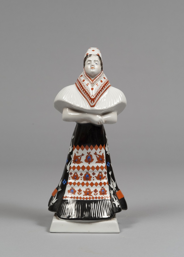 A CERAMIC FIGURE, BRAND HEREND, HUNGARY, MID 20TH CENTURY in polychrome enamels depicting women in