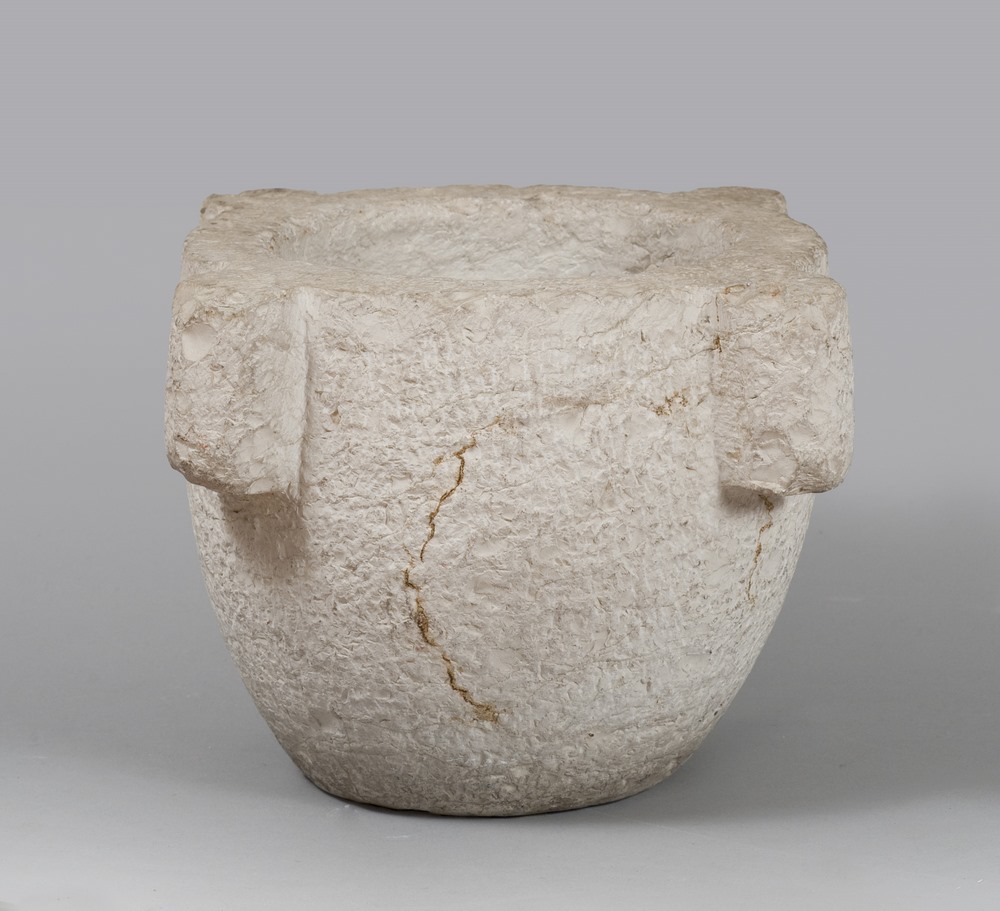 A CARVED STONE MORTAR, 15TH CENTURYwith handles on side.Measurements cm. 26 x 40 x 40.