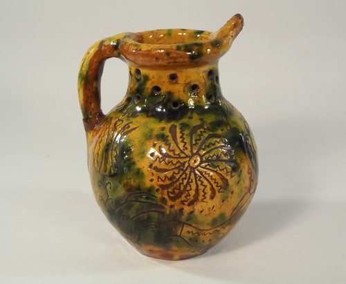 DONYATT PUZZLE JUG.
A Donyatt, Somerset slipware puzzle jug dated 1851. Sgriffito decorated with