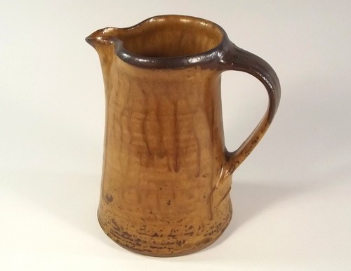 LOWERDOWN POTTERY.
A Lowerdown Pottery pint jug. Pottery mark. 
Height 16cm.