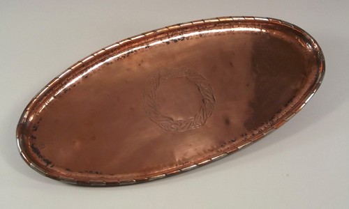 WALLIS COPPER.
A Hugh Wallis school oval tray with leaf & berry motif. Stamped mark 'HW'. Length