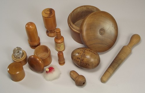WOOD WARES.
A collection of turned wooden boxes, including a cut glass scent bottle in Mauchline