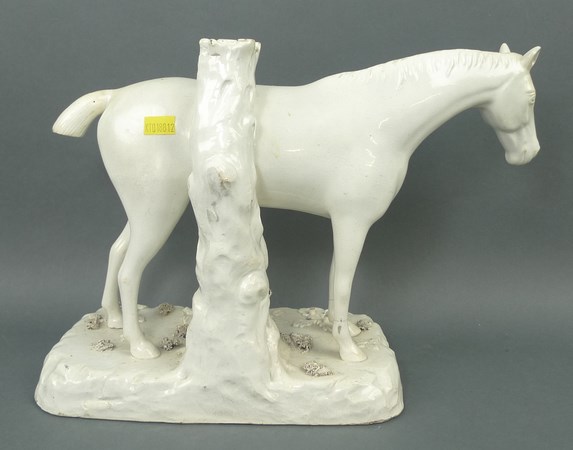 A stoneglazed figure of a horse, circa 1820, modelled standing against a tree stump, 34 by 13 by - Image 2 of 3