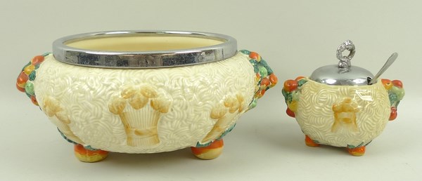A Clarice Cliff 'Celtic Harvest' pottery fruit bowl with a metal rim, 26 by 12cm, and a preserve pot
