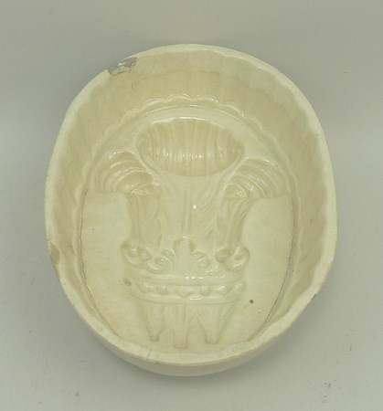 A creamware jelly mould, early 19th century, moulded with the Prince of Wales feathers, 17.5 by - Image 2 of 3