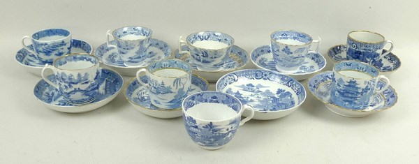 A quantity of Spode and other porcelain coffee cans or cups and saucers, early 19th century,