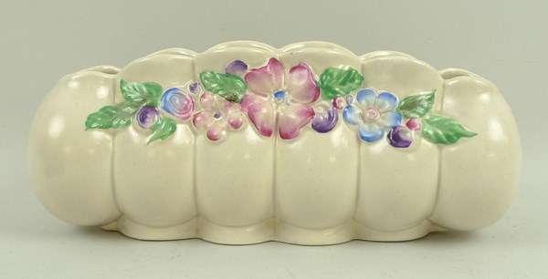 A Clarice Cliff pottery quintel vase moulded with flowers, shape 861, printed mark, 20 by 6 by 8cm.