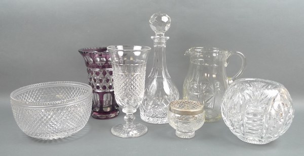 A group of crystal ware, comprising; a bowl, decanter, two vases, a water jug, and a celery vase. (