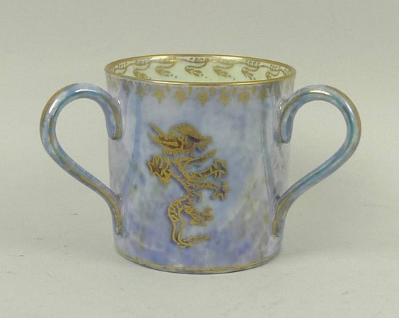 A Wedgwood miniature dragon lustre tyg decorated with dragons, dog of fo and a serpent against a