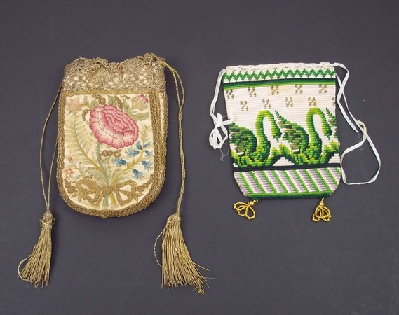 A late 17th / early 18th century purse, the ivory satin ground embroidered in gilt thread and