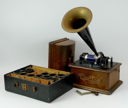 An Edison Model C phonograph, circa 1901, serial S 244358, with tin and brass horn, in an oak