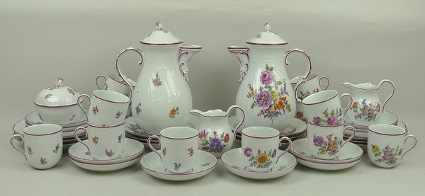 A Dresden porcelain coffee service, 20th century, of spiral fluted form painted with flowers,