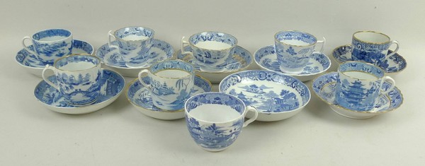 A quantity of Spode and other porcelain coffee cans or cups and saucers, early 19th century,