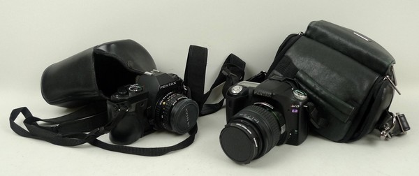 A Digital ISDL2 Pentax camera together with the batteries and charger, and a Pentax P30N with 50mm