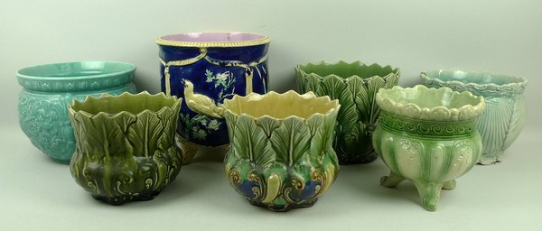 A majolica jardiniere, late 19th century, moulded with panels of birds, bullrushes and flowers