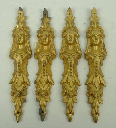 A set of four French gilt brass appliques, late 19th century, of figural leaf form, 14.5cm long.