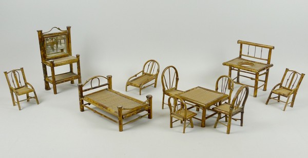 A quantity of early 20th century bamboo cane doll's furniture, comprising; a hall stand, table and