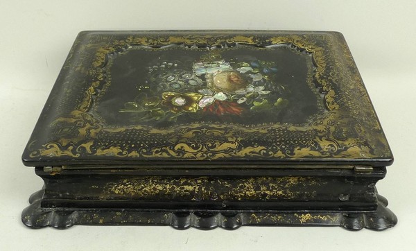 A Victorian papier mache writing slope, the lid with recessed top decorated with flowers, the box