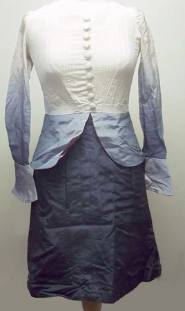 A 1960's grey and cream grosgrain taffeta fitted dress with covered buttons to the bodice, peplum