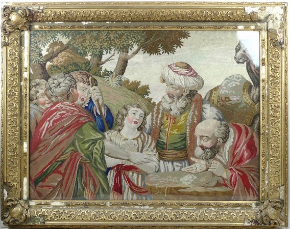 An early 19th century needlepoint tapestry of a biblical scene, 'David being sold into slavery',