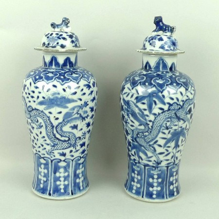 A near pair of Qing dynasty, late 19th century, porcelain vases of baluster form decorated in blue