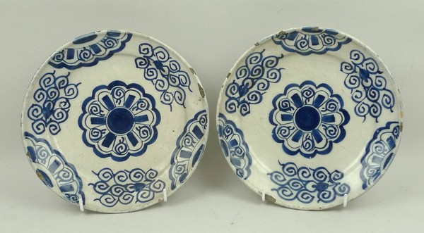 A pair of Continental tin glazed earthenware plates, late 18th century, decorated in blue and