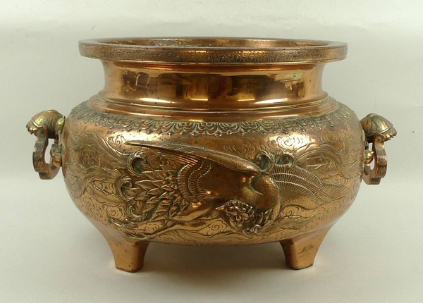 A south east Asian copper and brass alloy jardiniere, late 19th/early 20th century, of twin